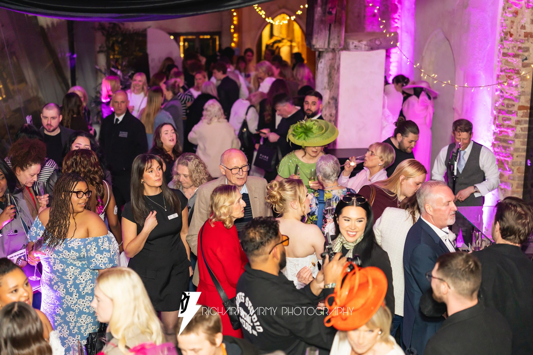 Guests networking at the Pure Brides Fashion Show, Dragon Hall