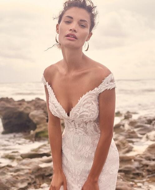 Model wearing a white Essense of Australia Gown