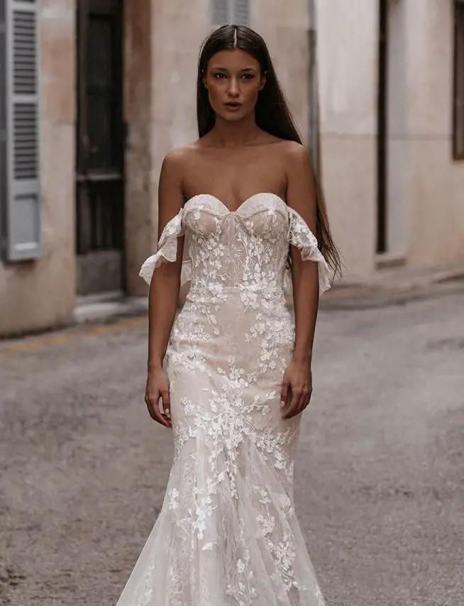 Model wearing a white Sophisticated Sleeves Gown
