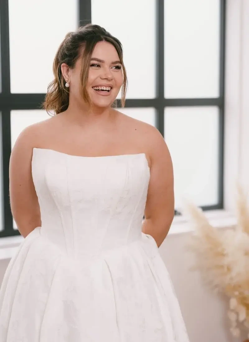 Model wearing a white bridal gown