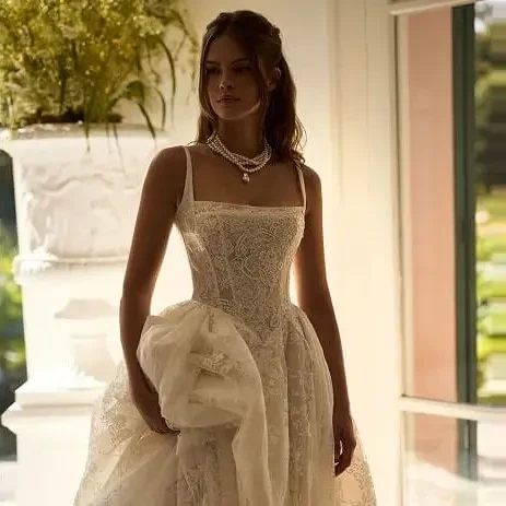 Model wearing a gown by Milla Nova