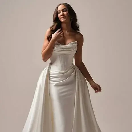 Model wearing a gown by Maggie Sotter